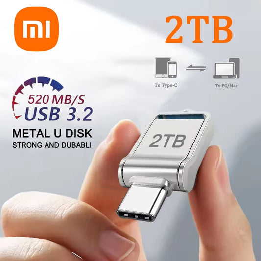 Metal U disk with USB 3.2 connection held by a hand, featuring Xiaomi logo and 2TB capacity text.